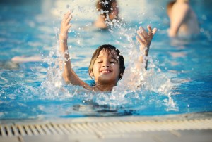 boy playing in pool at gatlinburg cabin with pool