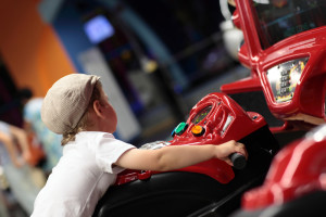 kid playing arcade games at Ober Gatlinburg